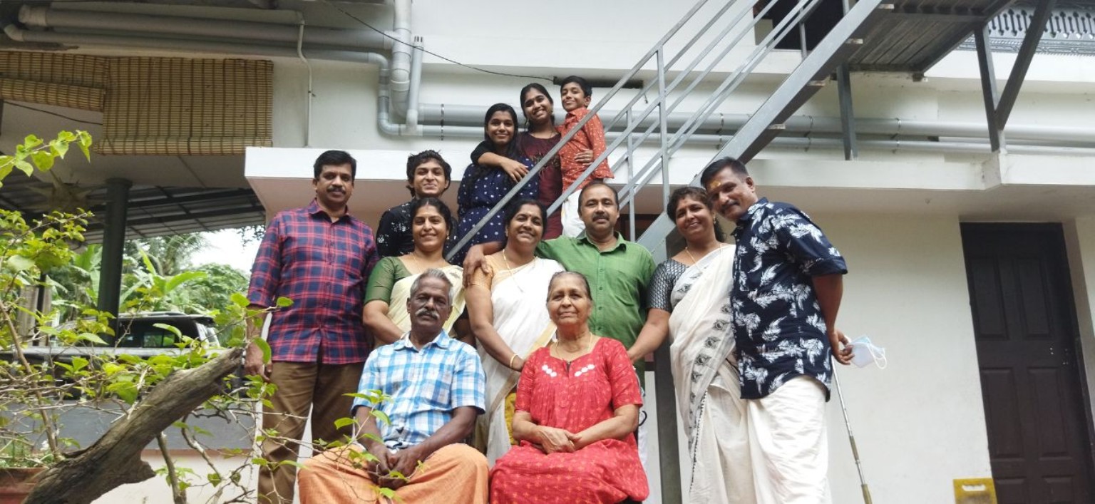 Family gathered outside their home